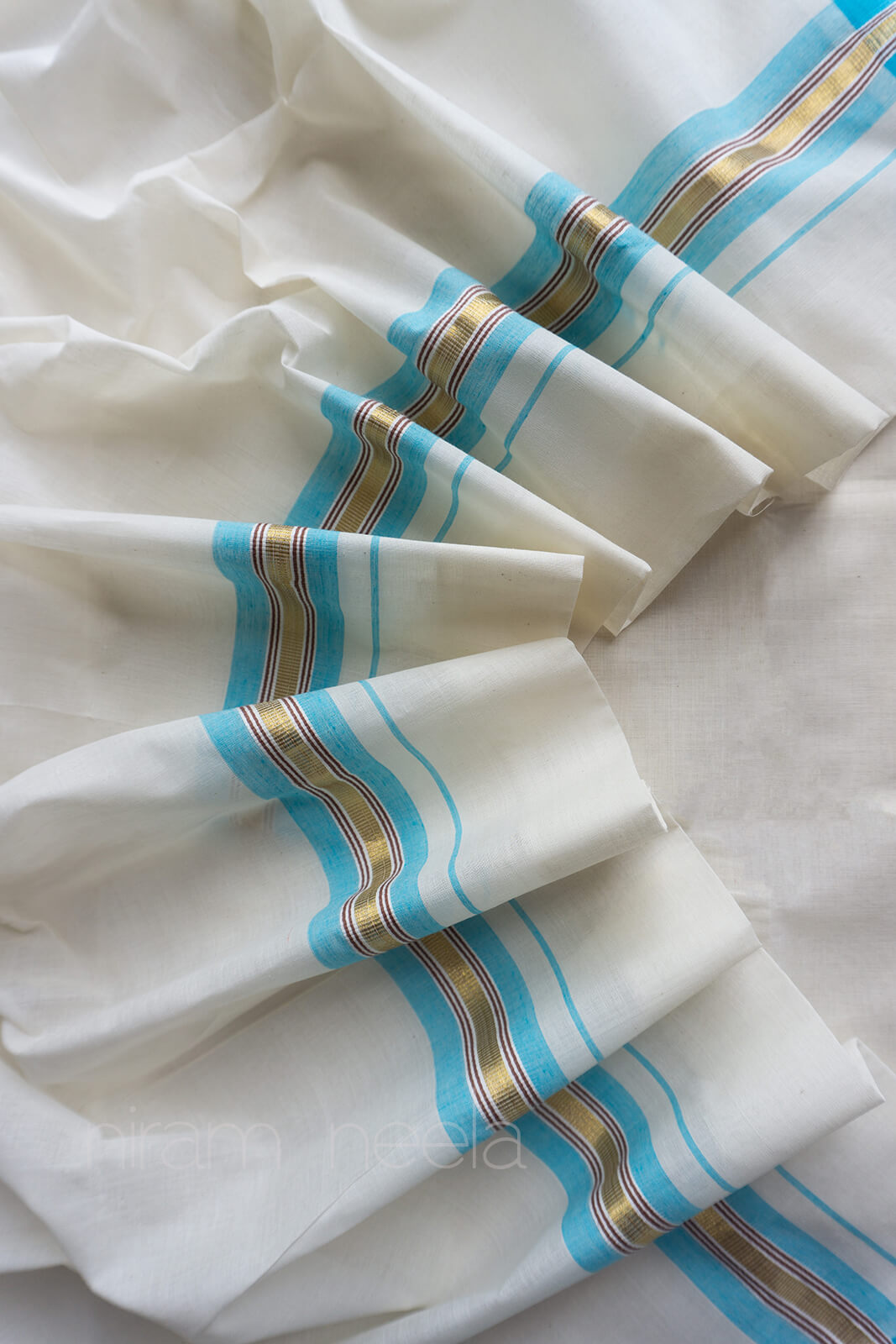 Ivory and sky blue double mundu - Niram Neela