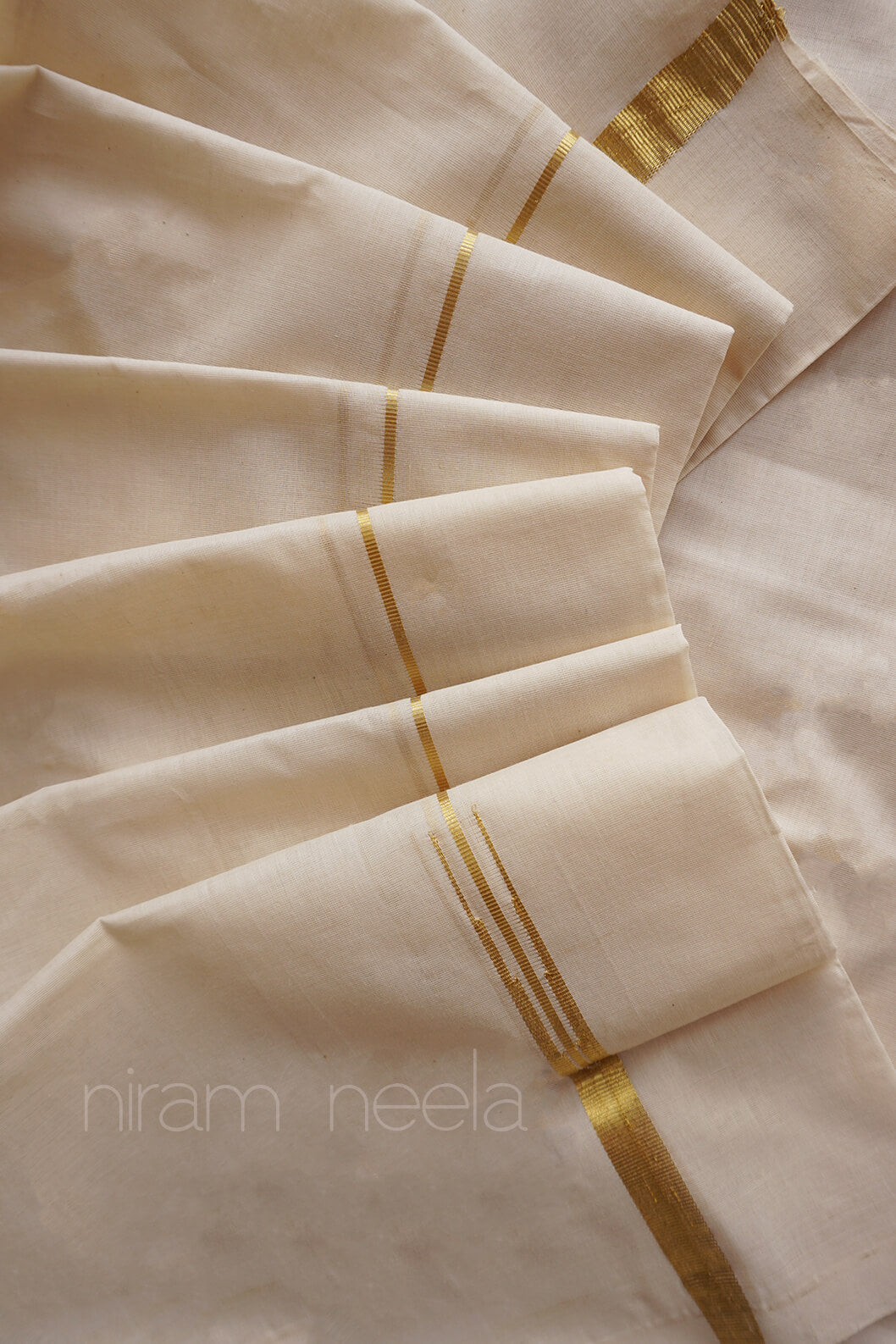 Ivory and gold puliyilakkkara pure zari double mundu - Niram Neela