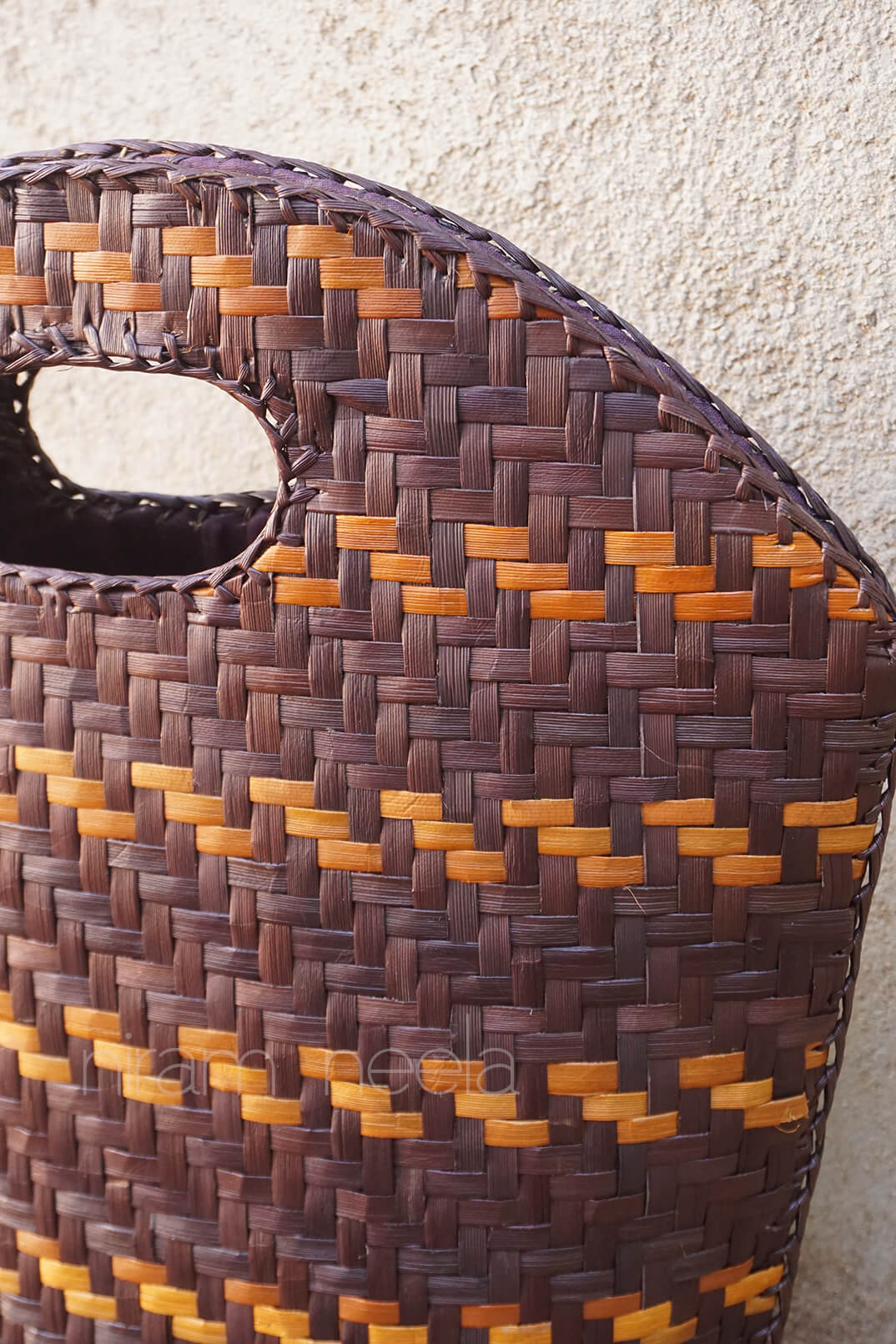 Brown and orange handmade screwpine bag - Niram Neela