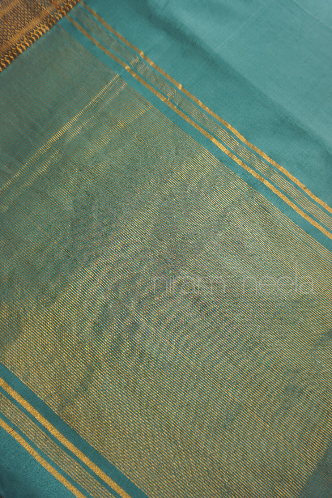 Teal and gold Mangalagiri cotton saree with Nizam border from Niram Neela