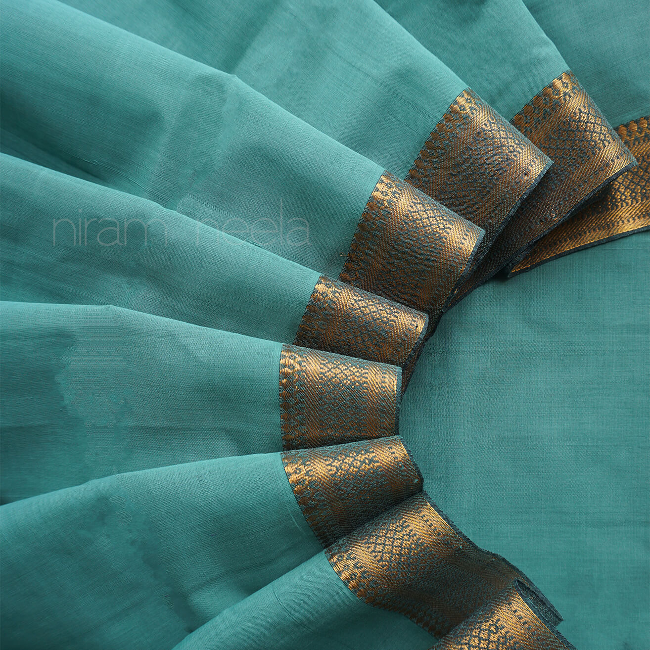 Teal and gold Mangalagiri cotton saree with Nizam border from Niram Neela