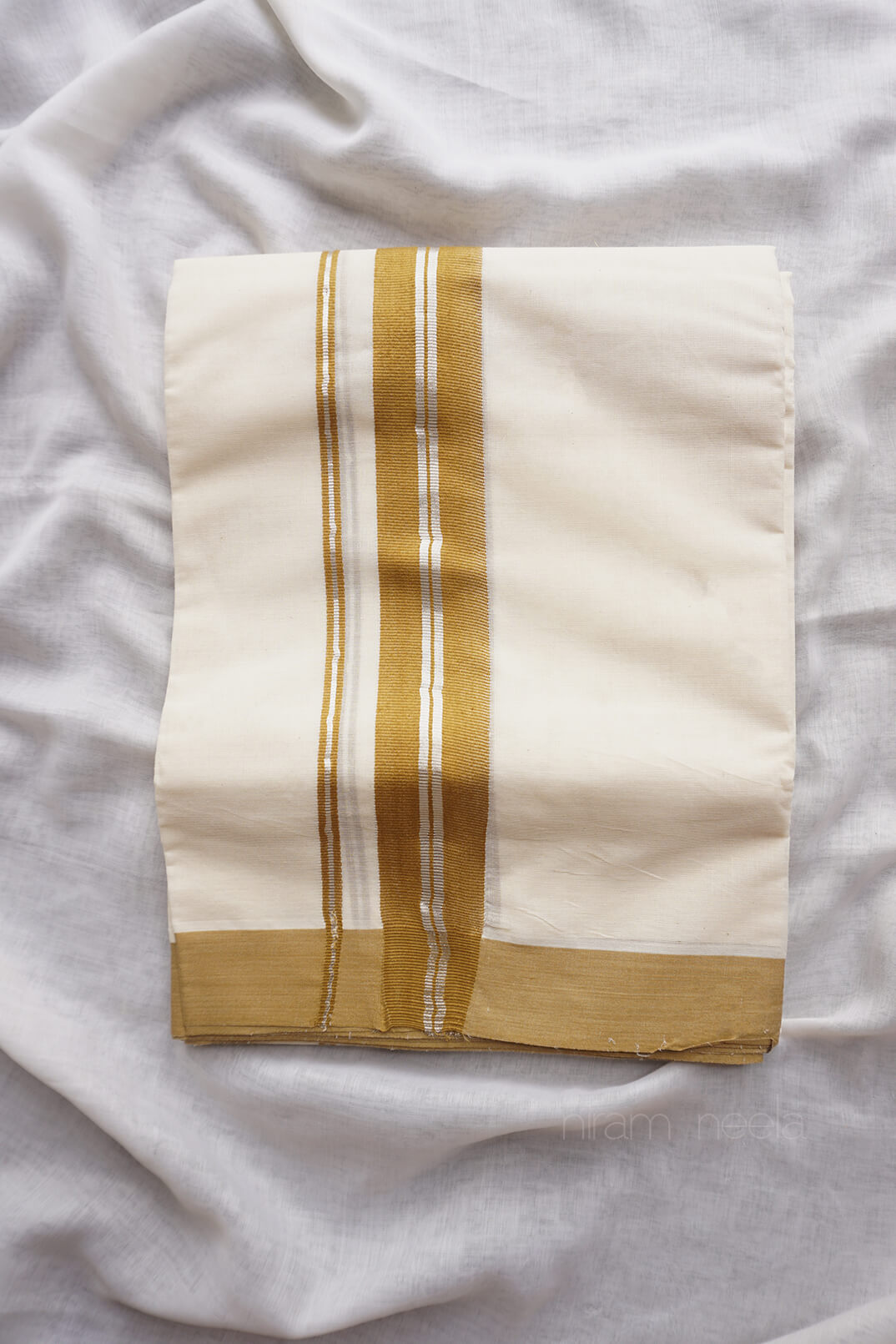 Ivory and mustard kasavu mundu - Niram Neela