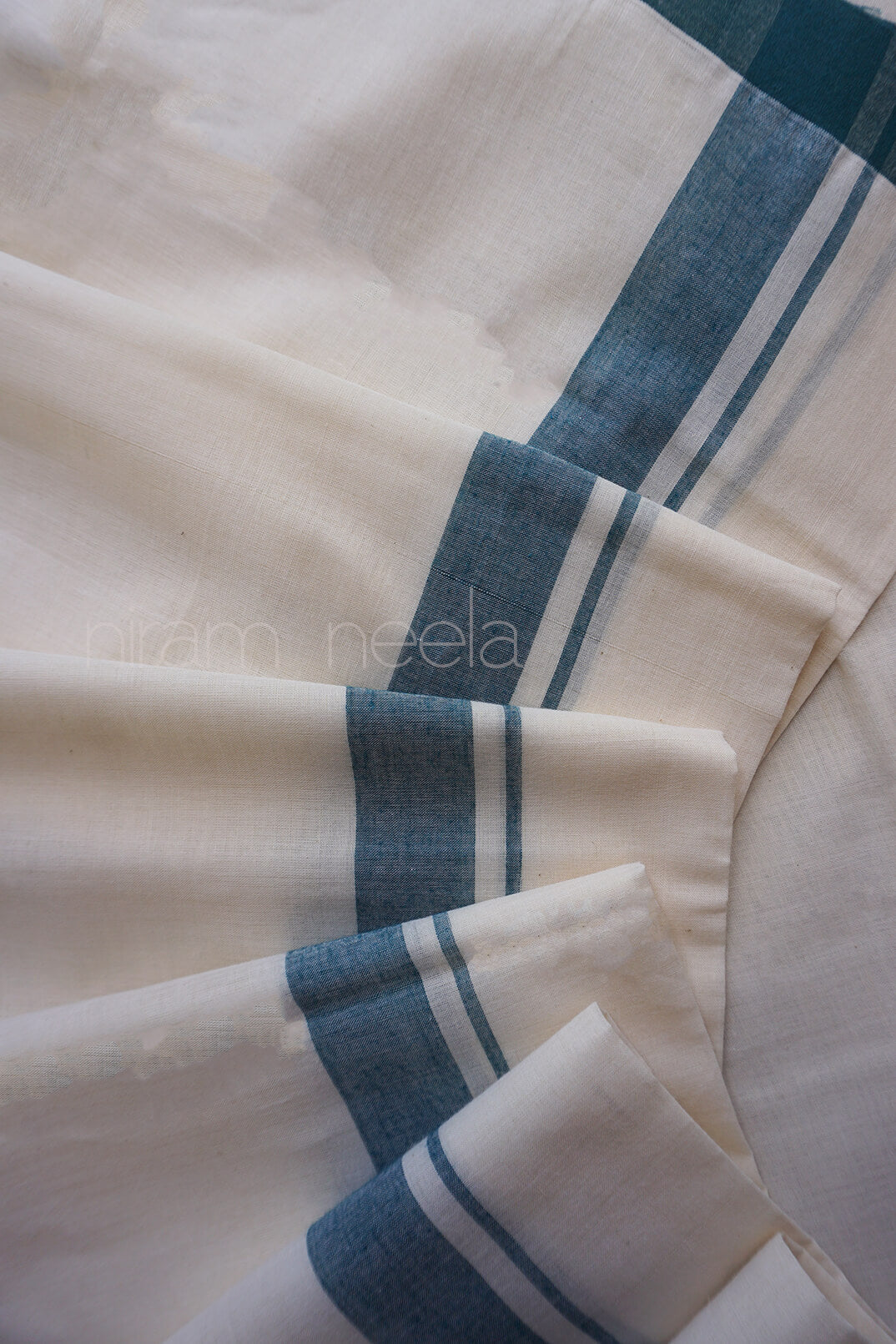 Ivory and green double mundu | Niram Neela