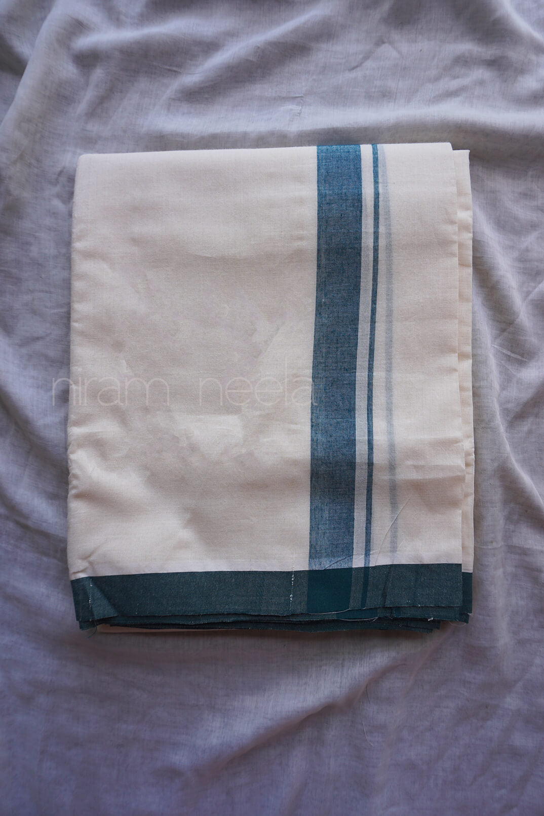 Ivory and green double mundu | Niram Neela