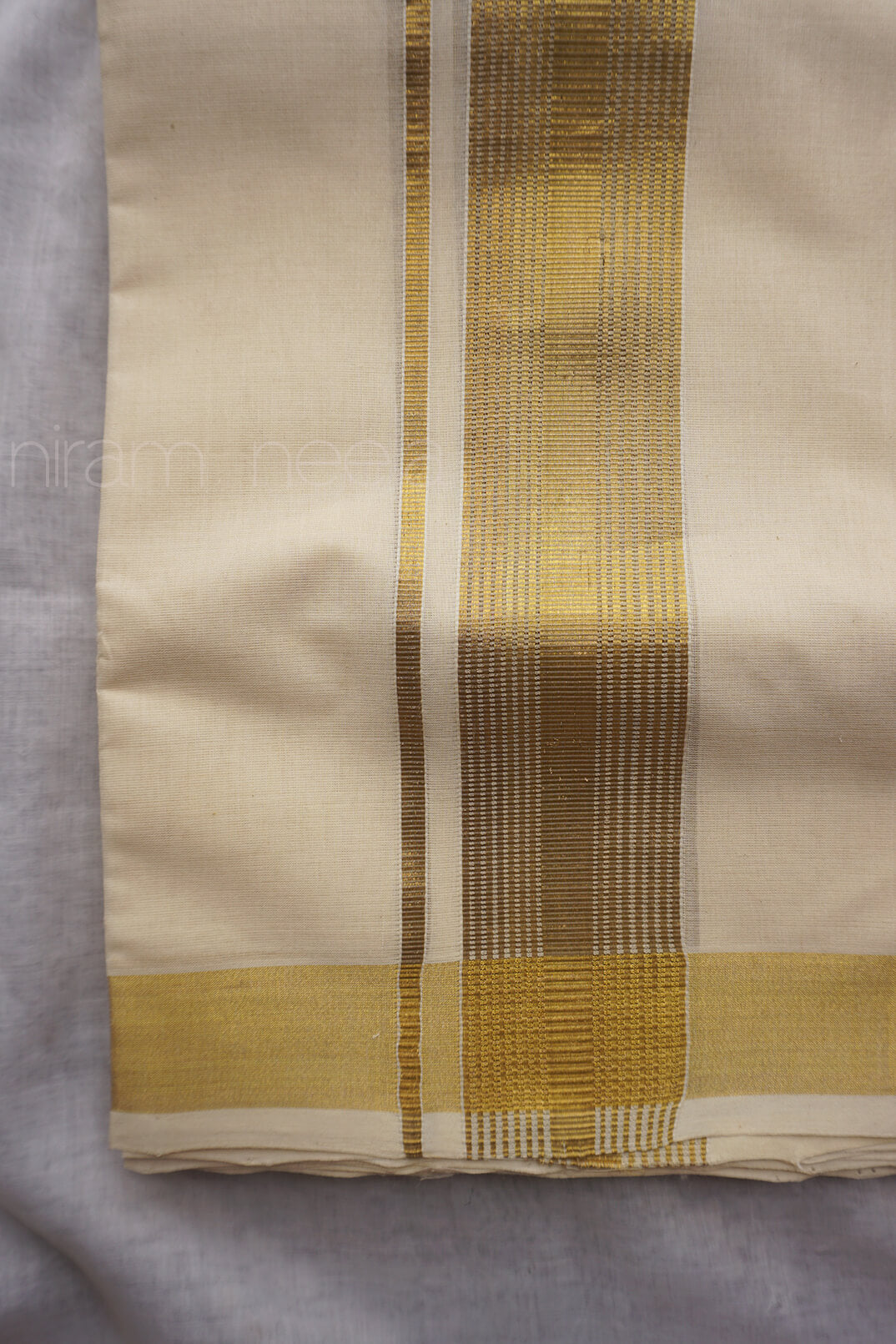 Ivory and antique gold double mundu | Niram Neela