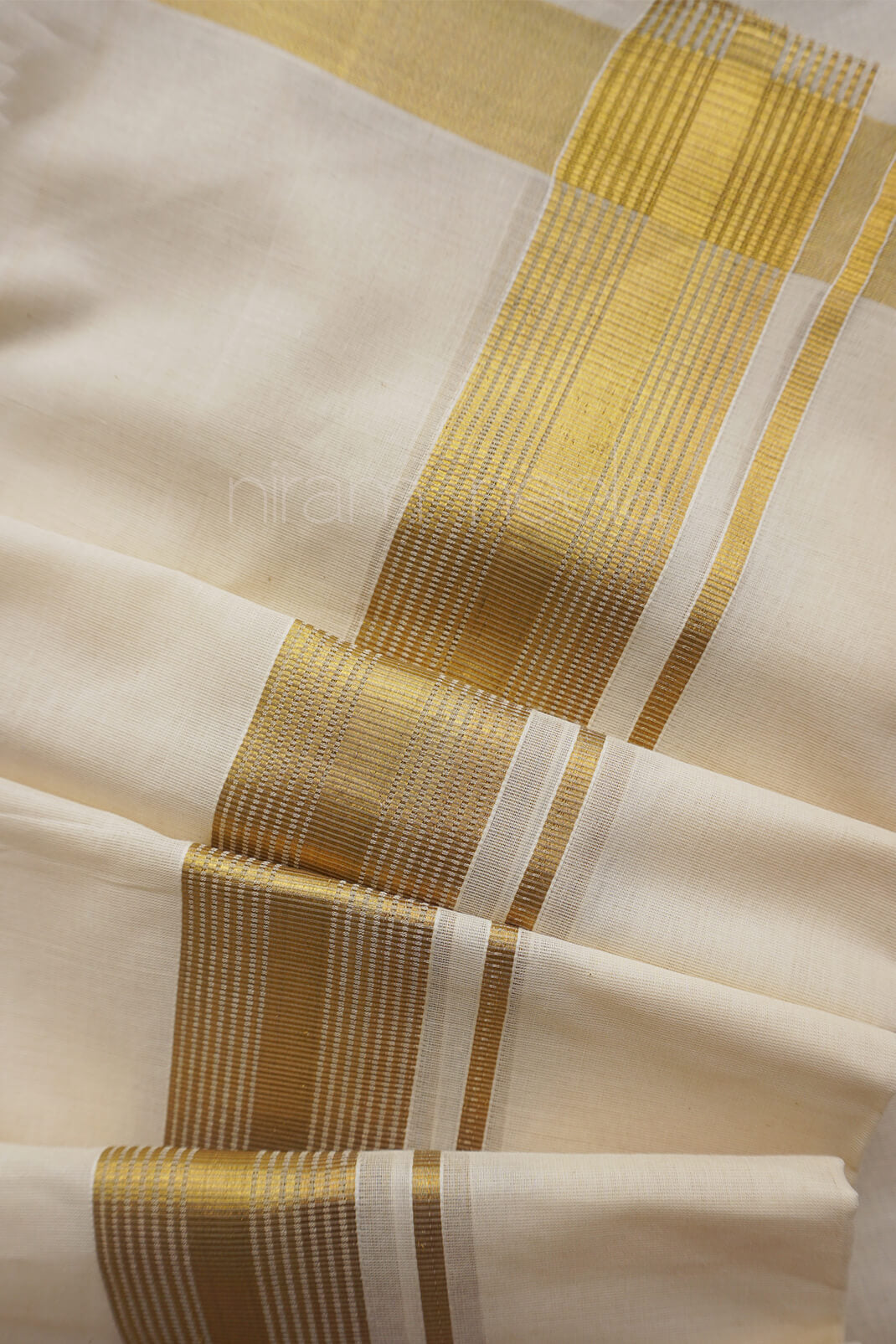 Ivory and antique gold double mundu | Niram Neela